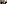 Auf dem Foto sind vier Personen zu sehen die in die Kamera lächeln. Es sind zwei Frauen und zwei Männer. Eine Frau hält einen Blumenstrauß. Sie wirken insgesamt fröhlich. 